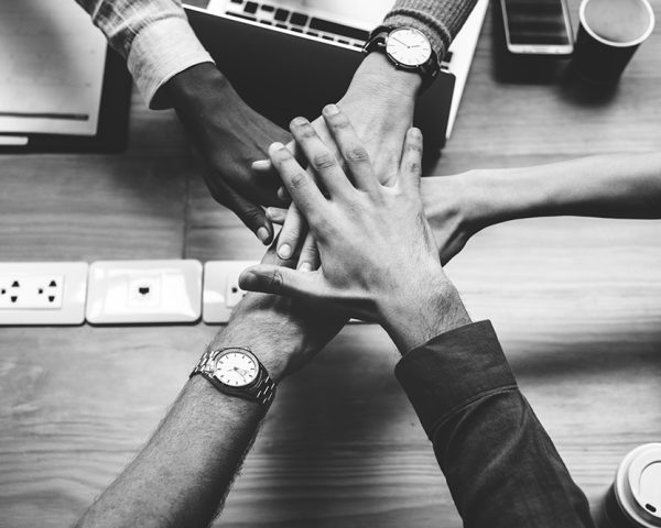team-business-people-stacking-hands